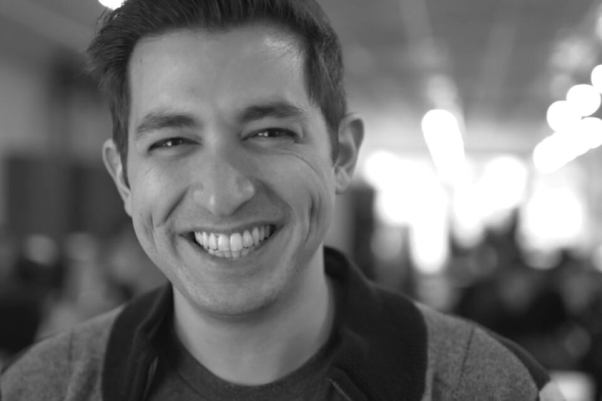 Avi Flombaum, smiling, black and white